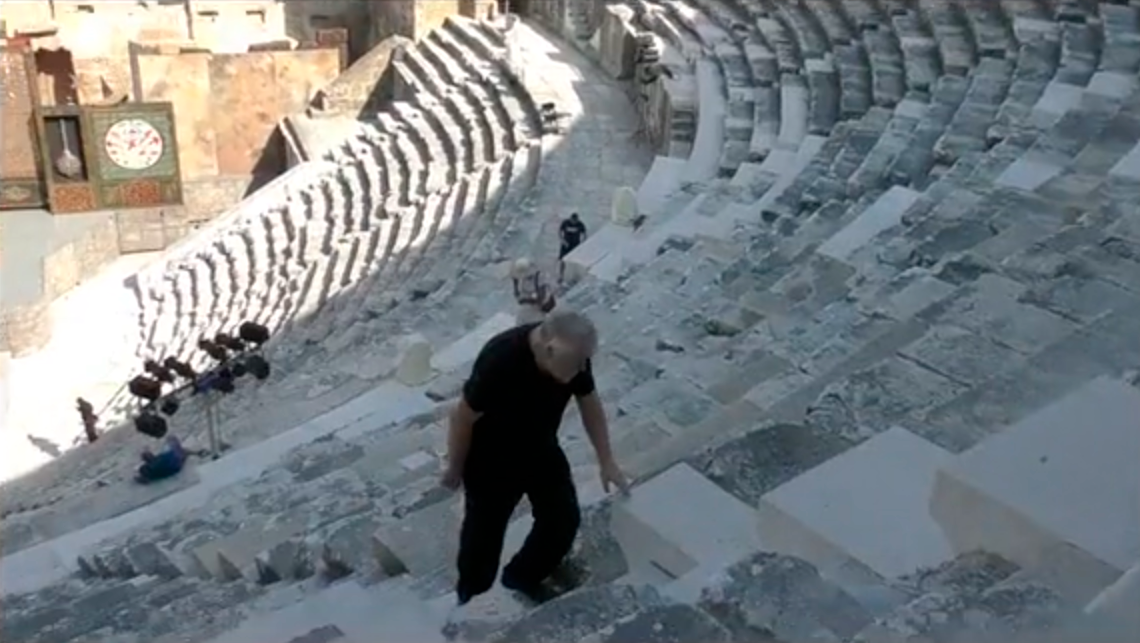 Aleksei Meniailov at the ancient theater of Aspendos. A frame from the video seminar "Secrets of Dionysus"