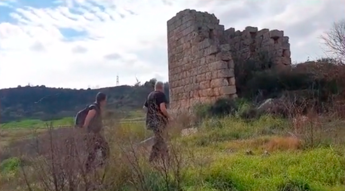 Aleksei Meniailov and his wife are heading towards the ruins of the supposedly walled city tower in the vicinity of Antalya. A frame from a video about ancient hippodromes