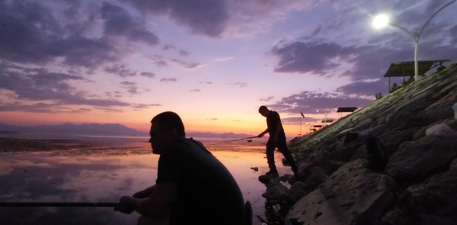 Readers of Aleksei Meniailov fish on Lake Beyşehir in the vicinity of Konya during a joint trip with the writer to Lake Beyşehir