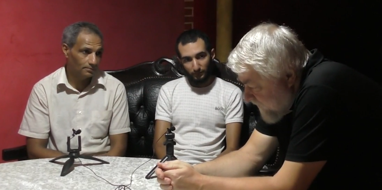 Writer Aleksei Meniailov talks with Moroccan speleologist Karim Sulbani (assisted by Russian-speaking translator Salahaddin Firari). The recording is being conducted for the video seminar "Conversation with a speleologist"