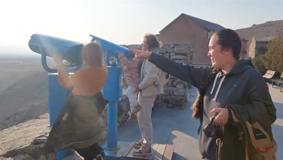 Slatana Meniailova, along with other tourists, is viewing Mount Ararat from the courtyard of the Khor Virap Monastery